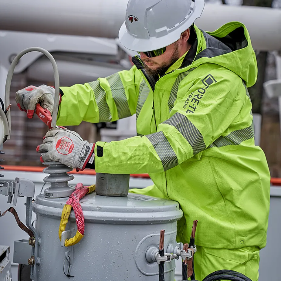 Electrical utility worker performing a routine maintenance task.