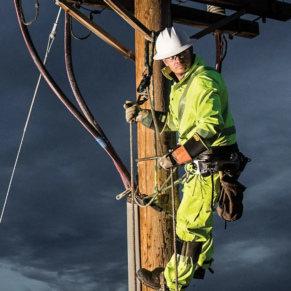 Electrical utility worker performing a highly demanding task.